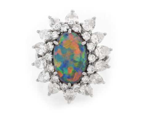 Vintage Tiffany & Co Oval Cabochon Black Opal, Pear Shape and Round Brilliant Cut Diamond and Platinum Ring. Opal with very g