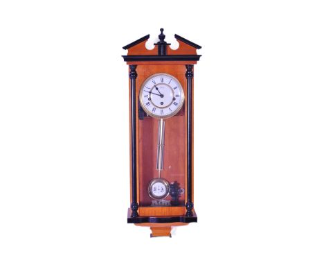 A NOS New Old Stock Hermle wall clock of architectural form with enamelled face wand roman numeral to the chapter ring. Westm