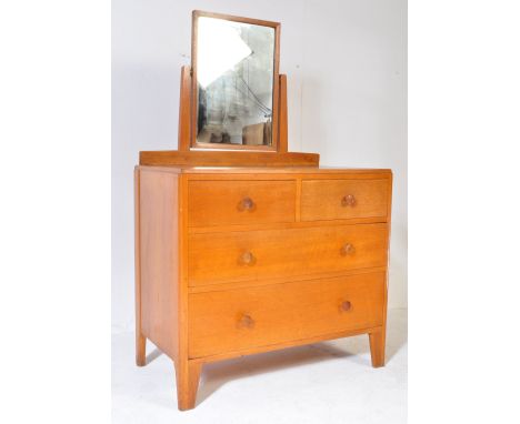 A vintage retro 20th century light oak M.O.D. Ministry of Defense dressing chest of drawers having a back squared mirror on s