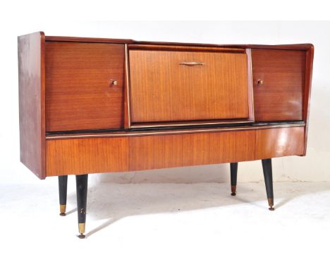 Beautility - A vintage retro mid 20th century teak Beautility sideboard. The cocktail credenza having a shaped top over a cen