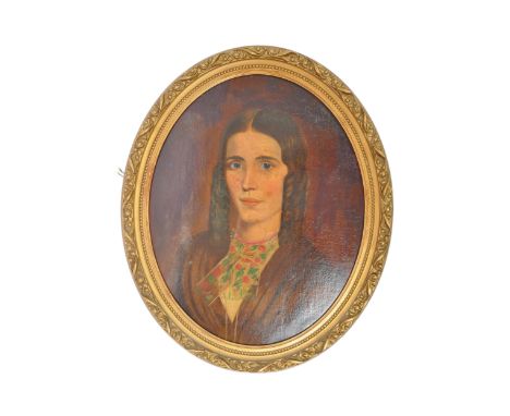 A 20th Century portrait painting. Of oval from wall hanging with a floral and gilt wood frame depicting a brunette society la