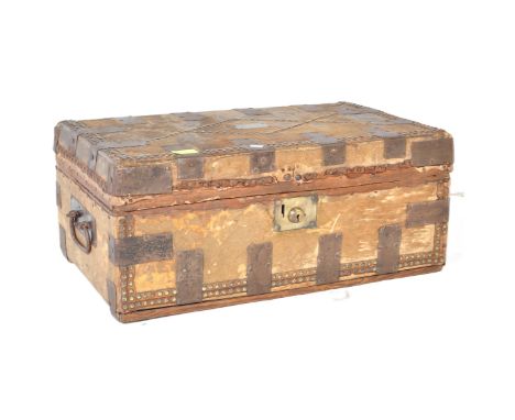 An early Victorian Pony skin travelling trunk with metal banding and brass stud work with twin carrying handles. Retains orig