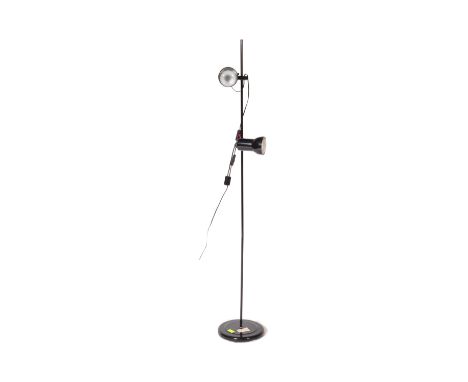 A vintage mid 20th Century standard standing floor light lamp. Of ebonised metal tubular construction with adjustable twin sp