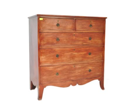 An early 19th century George III mahogany chest of drawers having a bank of two over three drawers, each with metal ring hand
