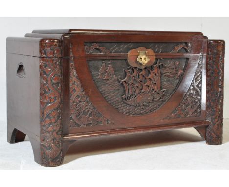 A large mid 20th Century Singapore camphor wood oriental carved chest / trunk blanket box with heavily carved with nautical s