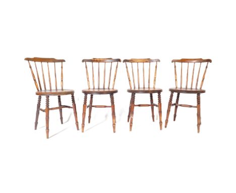 A set of four Victorian 19th century beech and elm penny windsor dining chairs, each with curvilinear top rail and spindle ba