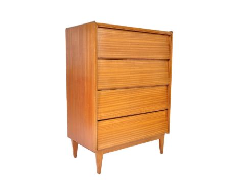 A retro vintage mid 20th Century teak chest of drawers. Of rectangular form with a bank of four drawers with a beehive front 