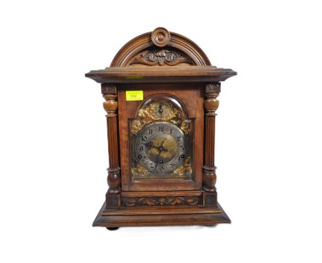 A 19th century German mahogany wall clock. The clock face having silvered chapter ring with Arabic numeral and gilded spandre