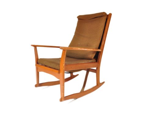 A retro vintage mid 20th century teak Parker Knoll style armchair / rocking chair. The chair having a teak skeleton with gree