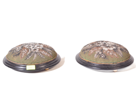 A pair of 19th Century Victorian glass beadwork tapestry footstool / rests with ebonised wood frames with each raised on bass