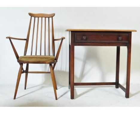 A mid 20th Century retro vintage beech and elm Goldsmith Ercol chair and desk writing table. Having a straight spindle back w