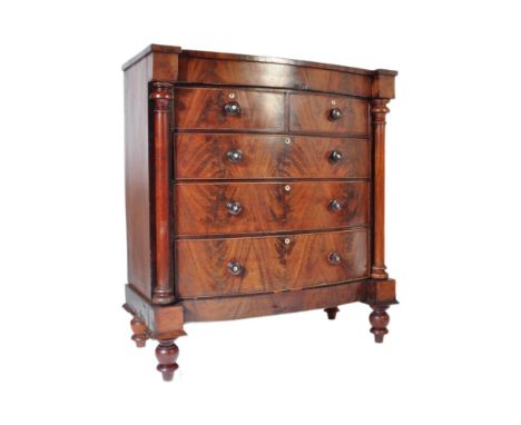 A 19th Century Victorian flame mahogany Scottish bow front chest of drawers. Of rectangular form with two over three chest of