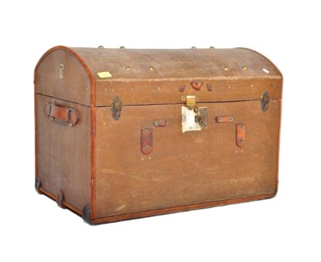 An early 20th Century vintage travel railway trunk chest. Of leather wood brass construction with dome top with initials C. B