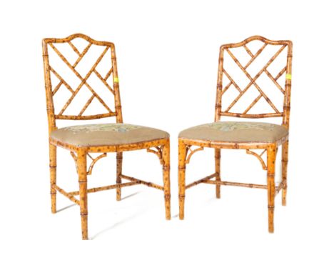 A pair of 18th Century style faux bamboo chairs having painted back simulating bamboo with decorative worked backrest and tap