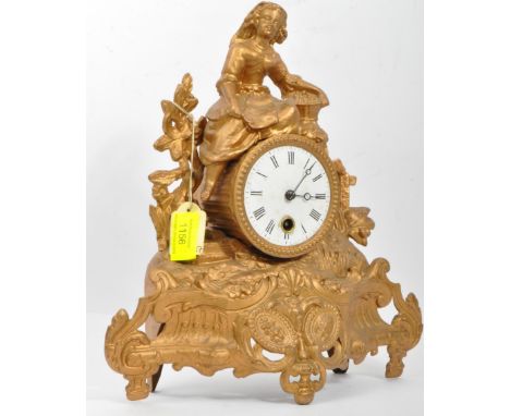 A 19th century French gilded mantel clock. The clock having enamelled face with black roman numeral to chapter ring. The cloc