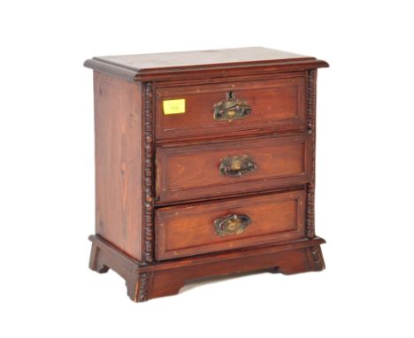 A Victorian 19th century mahogany table top / apprentice piece chest of drawers. Raised on bracket plinth base with an uprigh