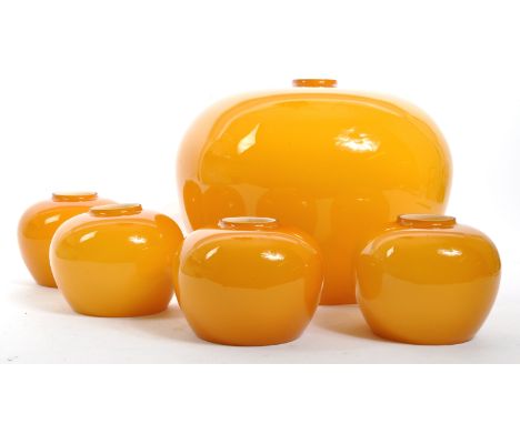 A set of retro vintage mid 20th Century orange glass lamp light shades. Of bulbous form with a large hanging ceiling light sh