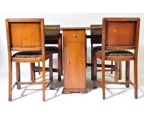 A retro vintage mid 20th century walnut drop leaf dining table with side drawer &amp; cupboard space. The table together with