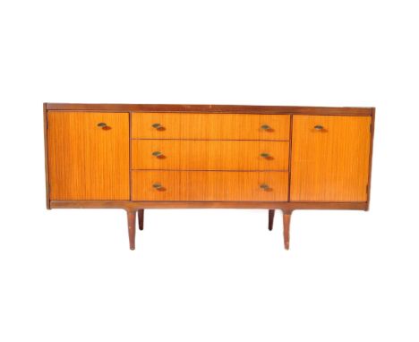 F Wrighton &amp; Sons Ltd, Walthamstow, London. A vintage mid 20th century teak wood sideboard credenza by Wrighton. Having a
