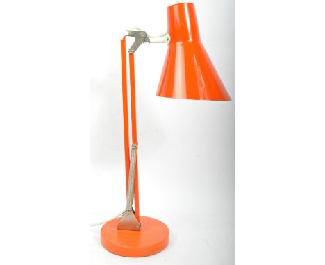 A retro vintage 20th century anglepoise style desk table top lamp. The lamp having a conical shade over an articulated boy ra