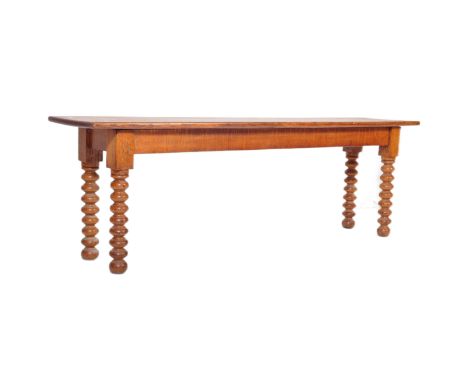 A vintage early 20th Century oak bench / window seat. The rectangular board seat atop chunk bobbin turned legs. Measures appr