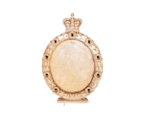 A vintage 20th Century composite stone mirror backing. With a crown atop surround by foliate wreath with light fitting holes.