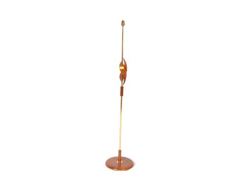 A vintage retro mid 20th century teak Danish inspired standard floor standing lamp. The lamp having abstracted detail to shaf
