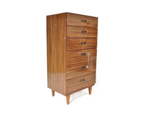 A retro vintage mid 20th Century veneered tallboy pedestal chest of drawers. Of rectangular form with a bank of six drawers w