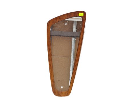 A vintage retro mid 20th century Danish inspired atomic wall mirror with mirror glass set against a teak mount of irregular f