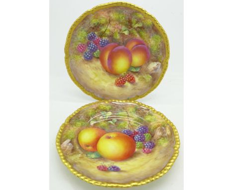 A pair of Royal Worcester hand painted plates, signed Freeman, 15cm