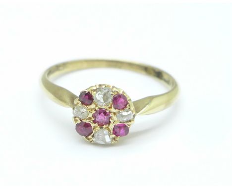 An 18ct gold, ruby and diamond cluster ring, 2.3g, N