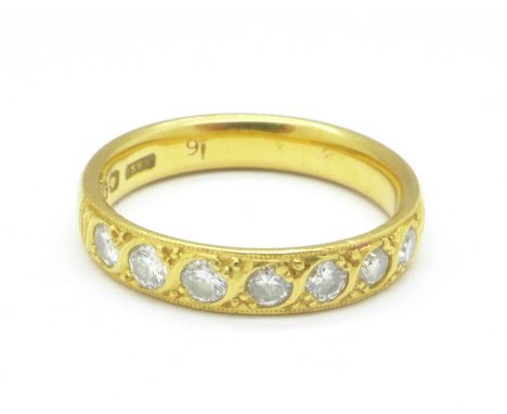 A 22ct gold and seven stone diamond ring, 5.6g, P