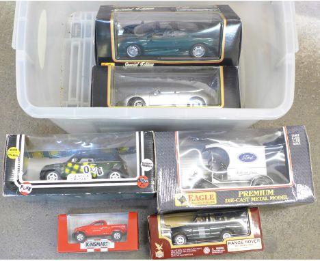 Six boxed die-cast vehicles including two Maisto, Jaguar XJ220 and a Porsche Boxster 1:18 scale