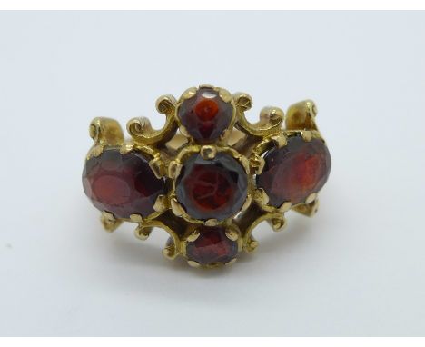 A 9ct gold and garnet ring, 4.7g, K, stones scratched