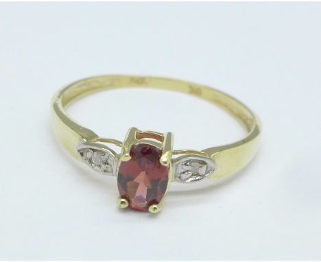 A 9ct gold, garnet and small diamond ring, 1g, O