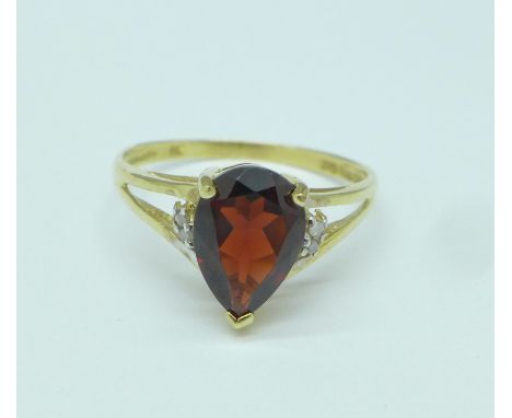 A 9ct gold, garnet and small diamond ring, 1.5g, O