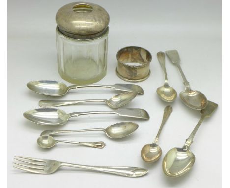 Nine silver spoons, a silver fork, a silver napkin ring and a silver topped glass hair tidy, 184g