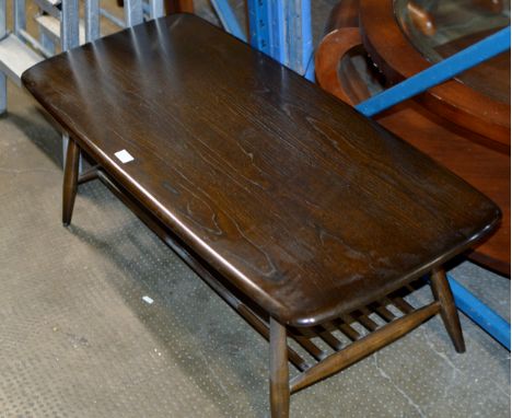 AN ERCOL DARK OAK COFFEE TABLE     