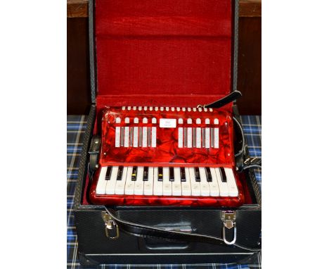 A VINTAGE ACCORDION WITH PROTECTIVE CARRY CASE     