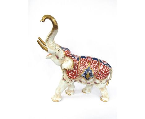 A circa 1920's/30's Imari porcelain elephant with raised trunk, manufactured by Aelteste Volkstedter, 51cm long 