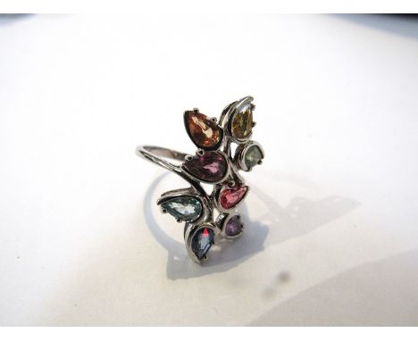 A 9ct white gold flower ring set with different coloured sapphires, size N/O 