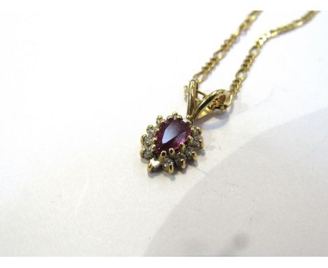 An 18ct gold ruby and diamond pendant on 18ct gold chain, 6.2g