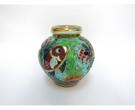 A ceramic vase ecorated with fish, 13.5cm tall