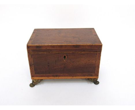 A Georgian tea caddy with lion paw feet, 14 x 20 x 13cm