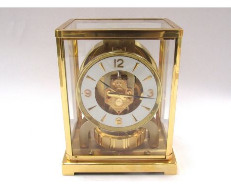 A Jaeger LeCoultre Atmos clock in gilt brass and glazed casing, no. 400968, 22cm high