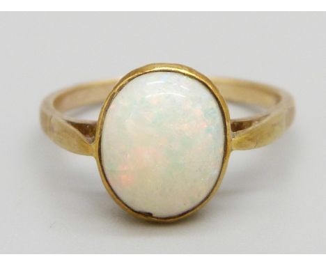 A 9ct gold and opal ring, 2.2g, P, opal approximately 8mm x 10mm and with small chip to the edge 