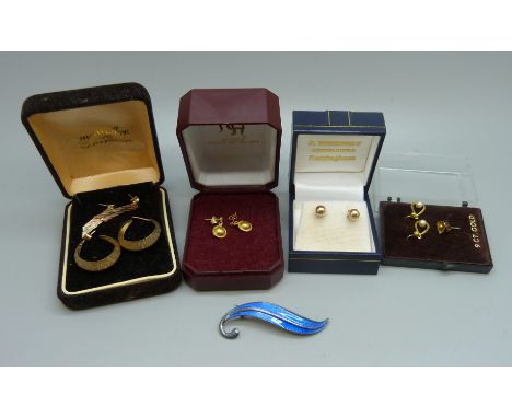 A pair of hallmarked 9ct gold hoop earrings, 2.5g, yellow metal earrings and a silver and blue enamel brooch 