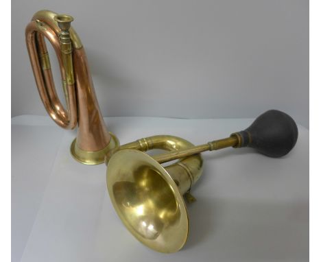 A brass car horn and a copper and brass bugle 