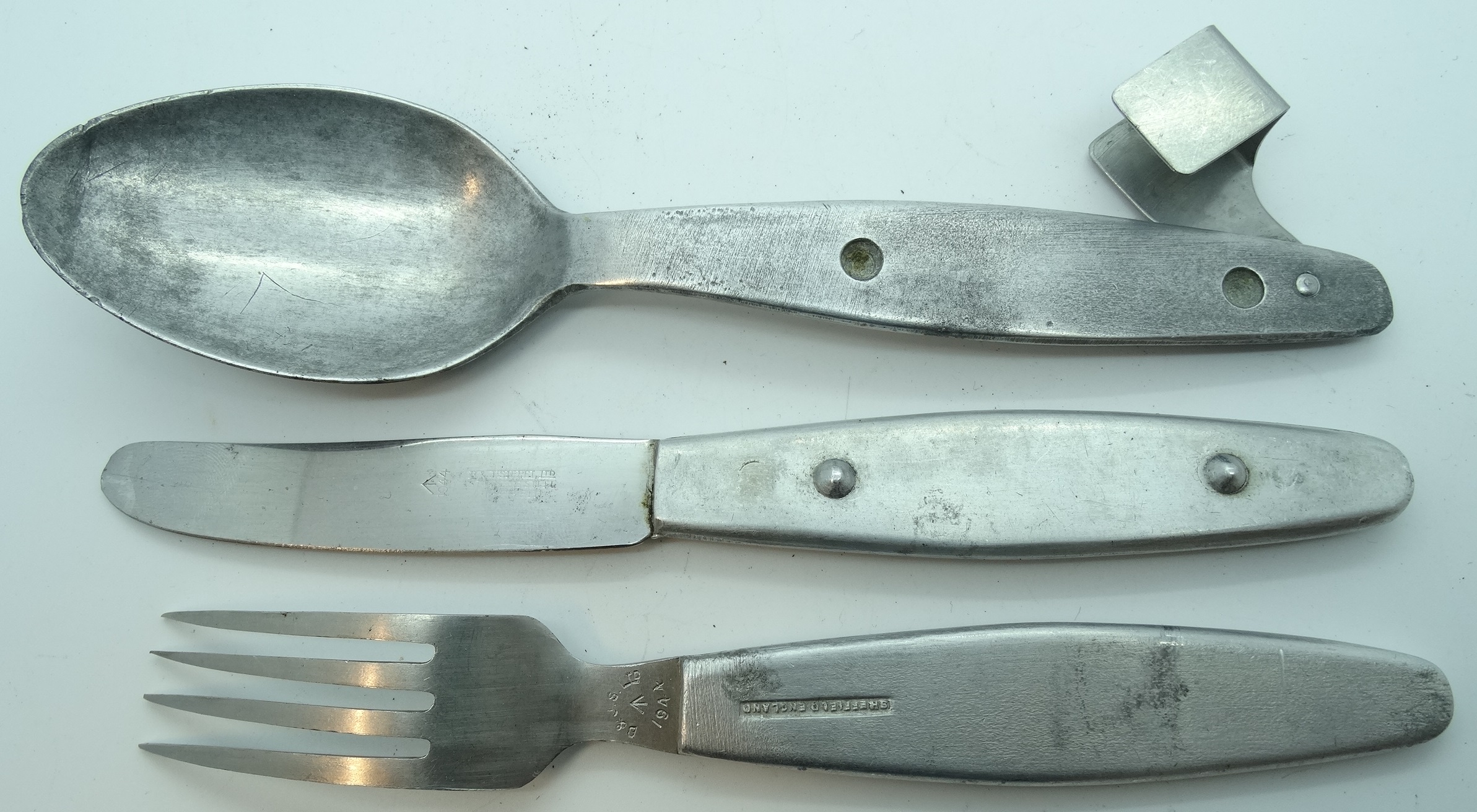 Alloy knife, fork & spoon in clip War department marked 1944 B&JS Ltd.