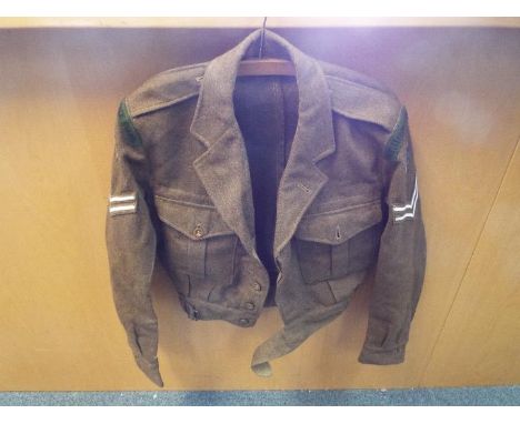Battledress blouse 1949 pattern, label for Milford Clothing Co Ltd, Belfast 1952, Intelligence Corps badges to each arm.